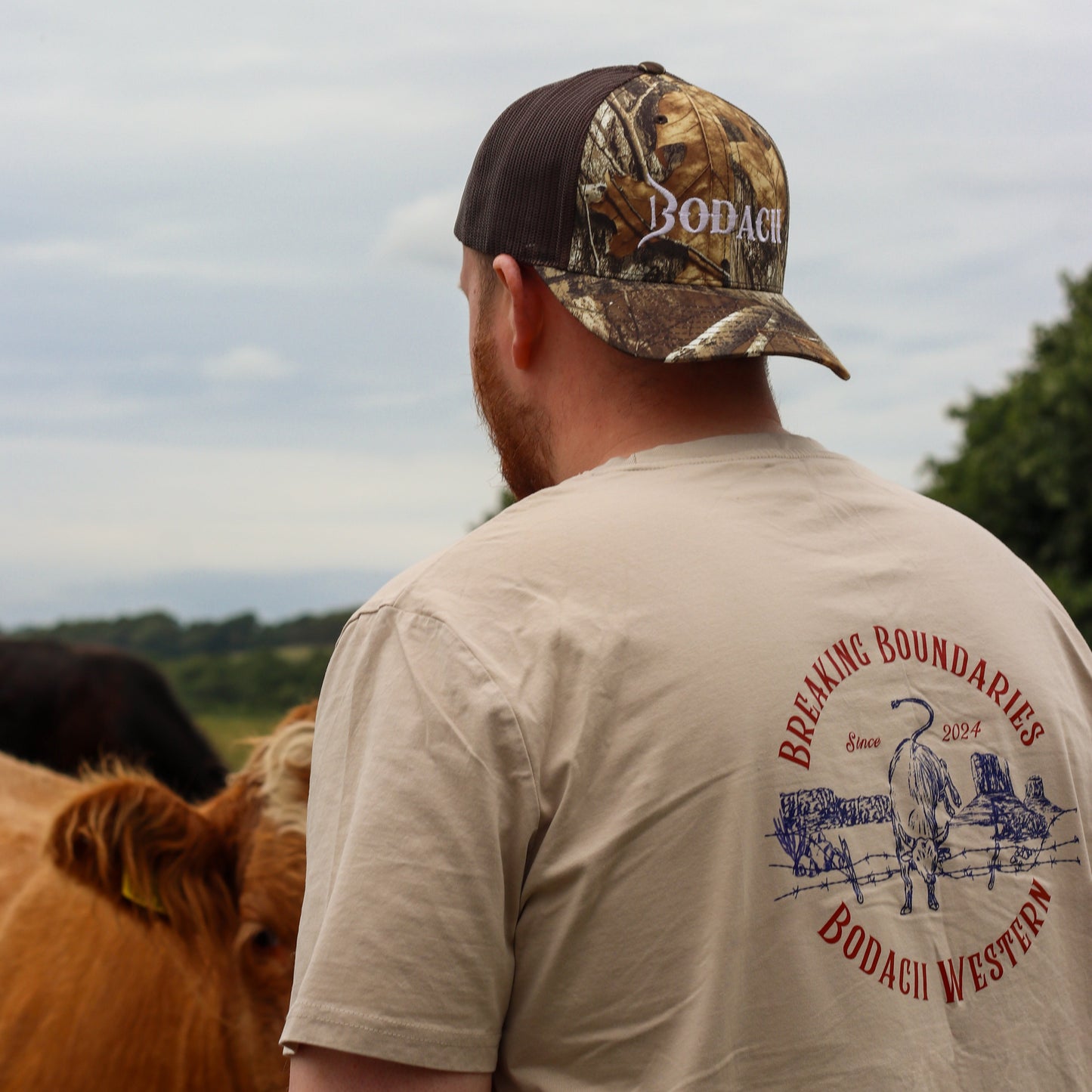 cowboy tshirt and realtree camo trucker cap