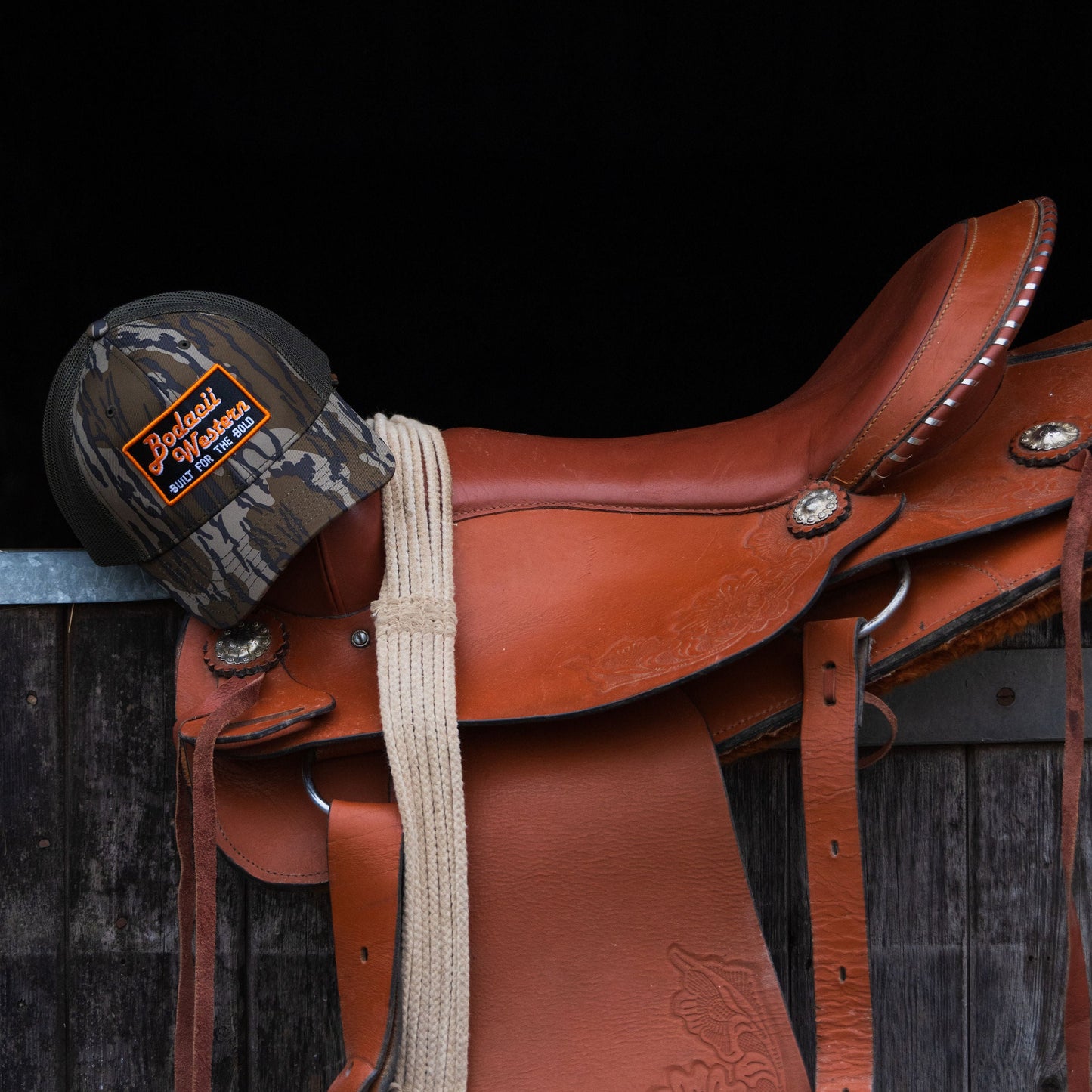 western saddle with camo trucker cap