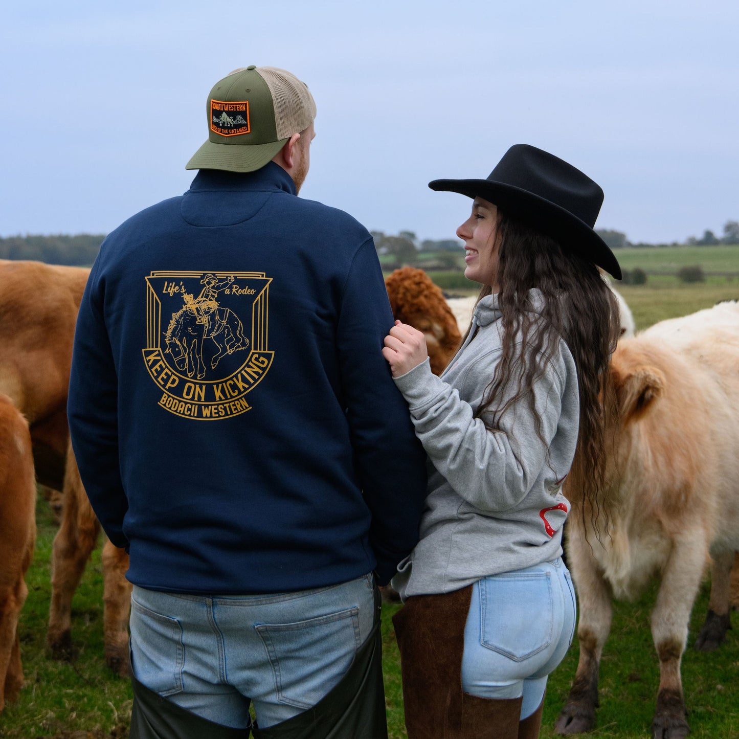 Cowboy and cowgirl on cattle ranch western fashion