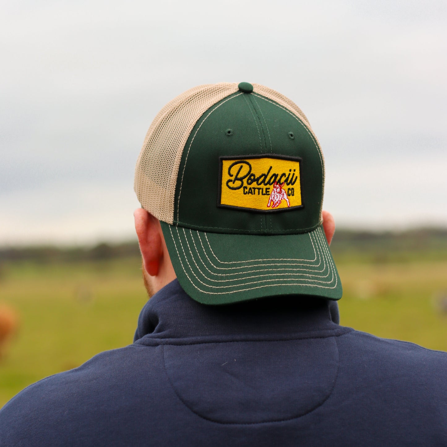 green trucker cap for cowboys and cowgirls with rodeo bull design