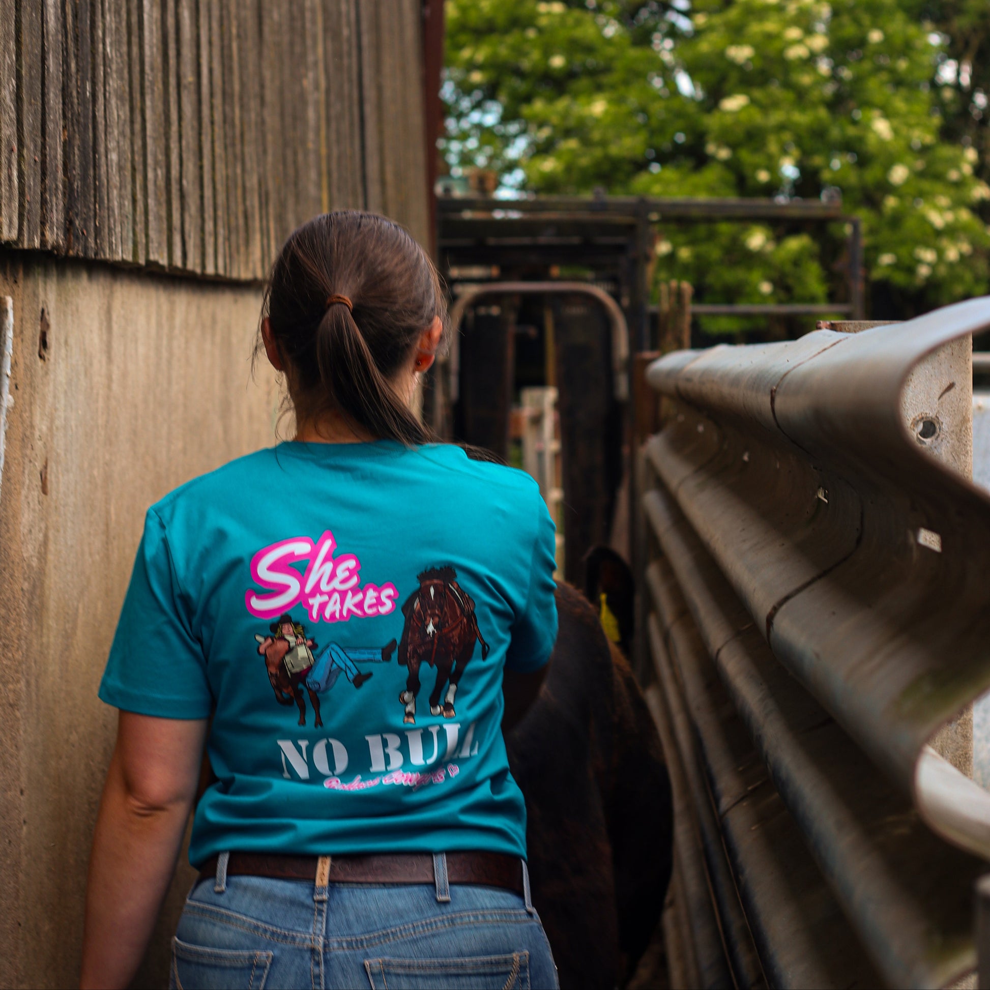 cowgirl wearing steer wrestling tshirt