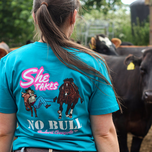 cowgirl wearing turquoise steer wresting tshirt